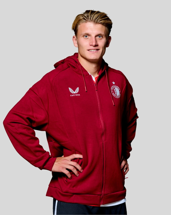 Man wearing red Feyenoord Travel Hoody with zip and hood, crest on chest