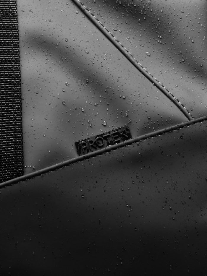 Close-up of the holdall exterior highlighting durable material and the ProTek water resistant finish.