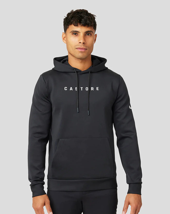 Front view of a man in a black Active Flex hoodie with CASTORE logo on the chest