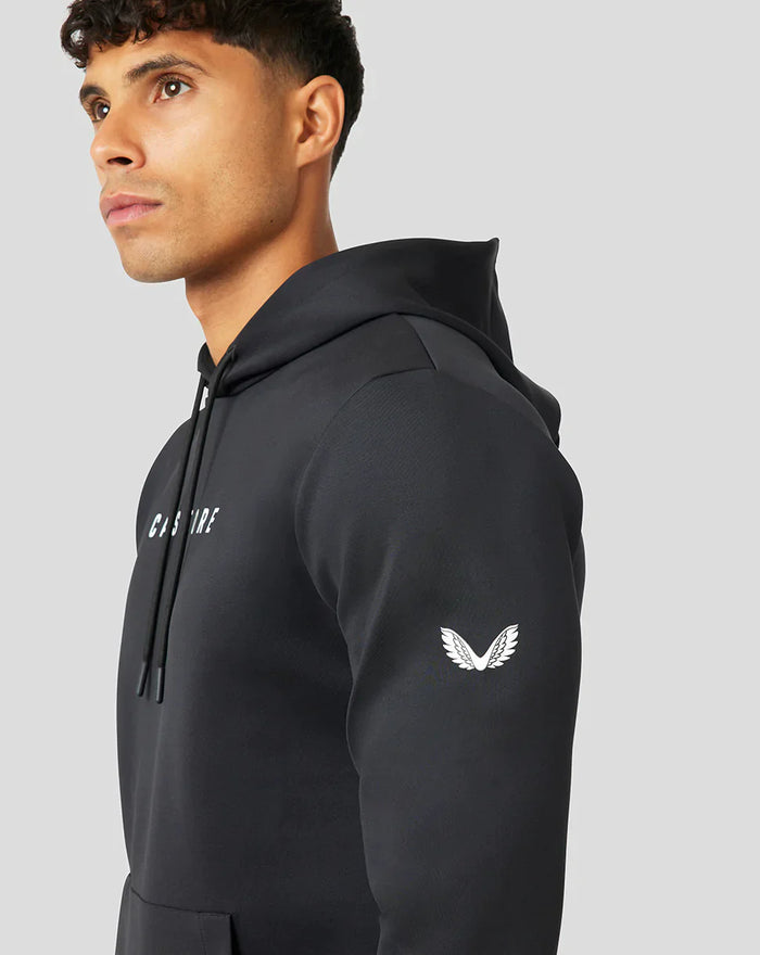 Profile view of a black Active Flex hoodie with hood up and white wing emblem on the sleeve.