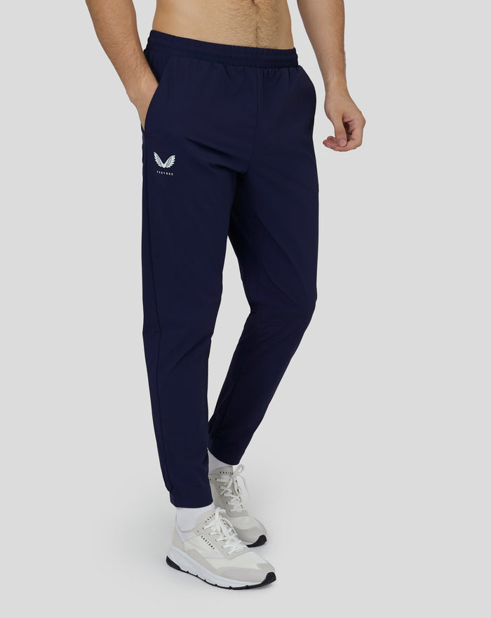 Front view of navy Castore woven Active Joggers for men with logo on the left thigh