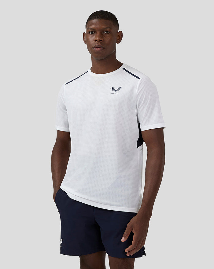 Male model wearing a white Apex Aeromesh T Shirt with navy shoulder accents front view