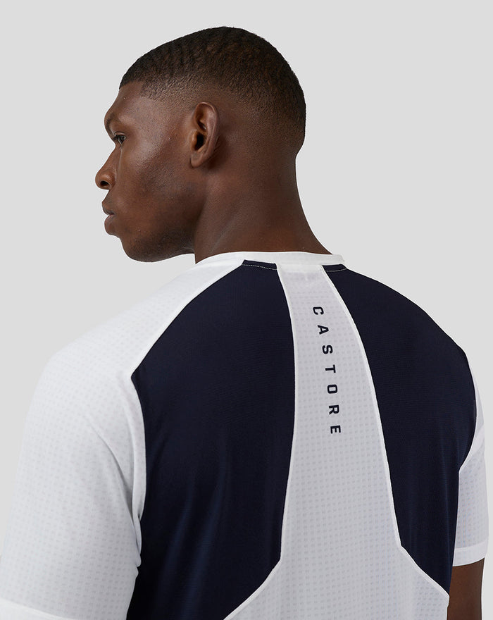 Back view of a male model in a white Apex Aeromesh T Shirt showing CASTORE branding along the spine