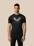 Male wearing a black graphic T-shirt with a silver wing logo and Castore text across the chest.