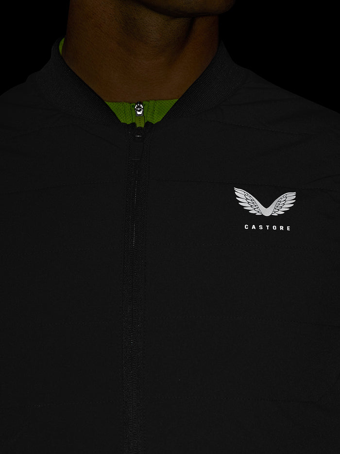 Close up of black Apex Training Gilet with front zip and reflective Castore logo on the left chest