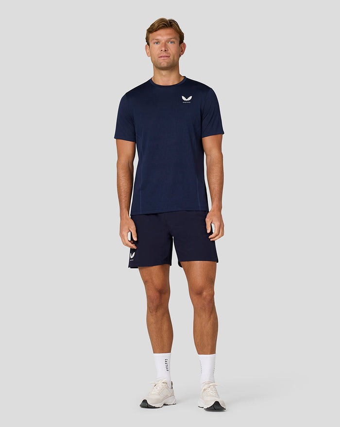 Male model in navy Apex Engineered Knit T Shirt paired with matching navy shorts