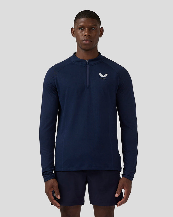 Front view of navy Apex engineered woven quarter-zip top for men with a stand-up collar and Castore logo on the left chest
