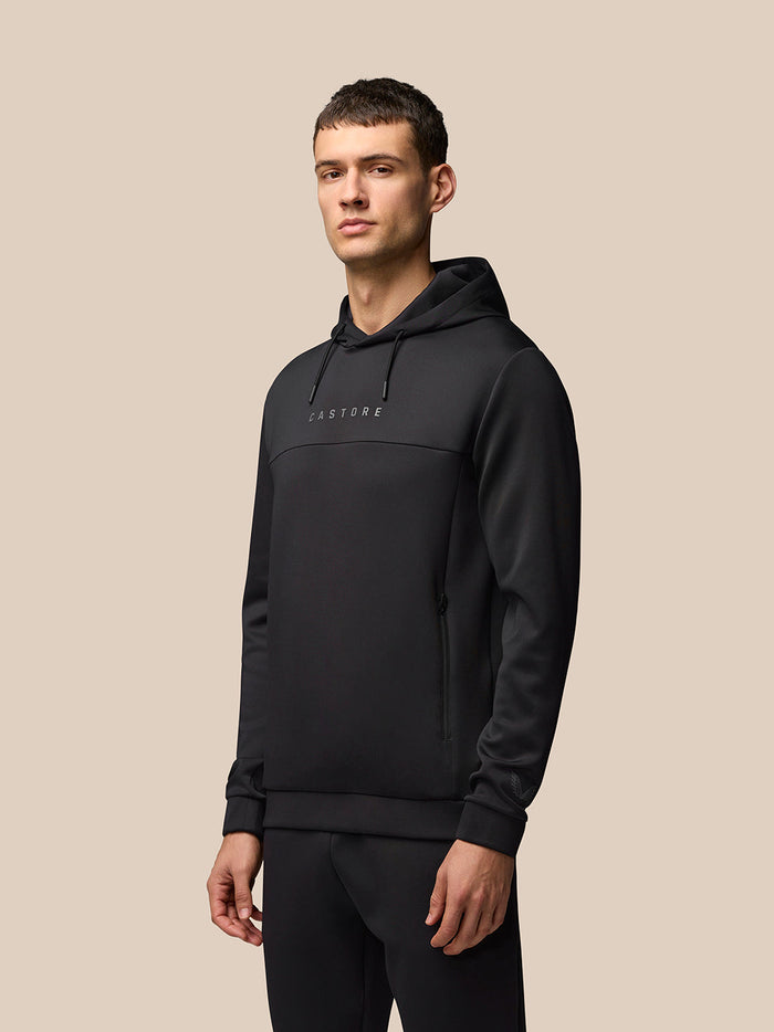 Man wearing black Flex Hoodie with hood and the CASTORE logo on the chest