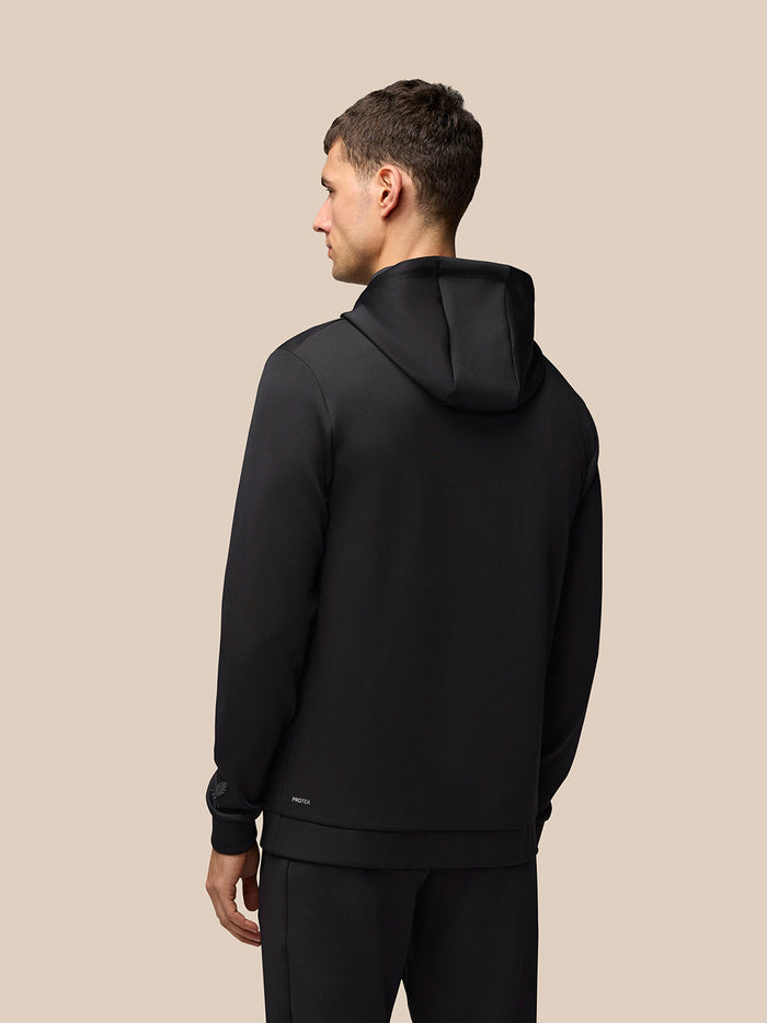 Back view of a man wearing a black Flex Hoodie with hood