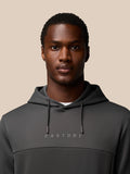 Close up of chest area on dark gray Flex Lifestyle Hoodie showing hood strings and Castore logo