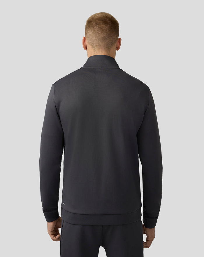 Back view of a man wearing charcoal Scuba Quarter Zip Top with long sleeves