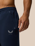 Close up of navy Travel Lifestyle Joggers waistband showing hidden zip pocket and Castore logo