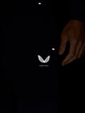 Detail of navy joggers with Castore logo on the thigh and subtle reflective accents