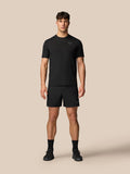 Man wearing black Apex Training T-Shirt with short sleeves and subtle Castore logo on chest
