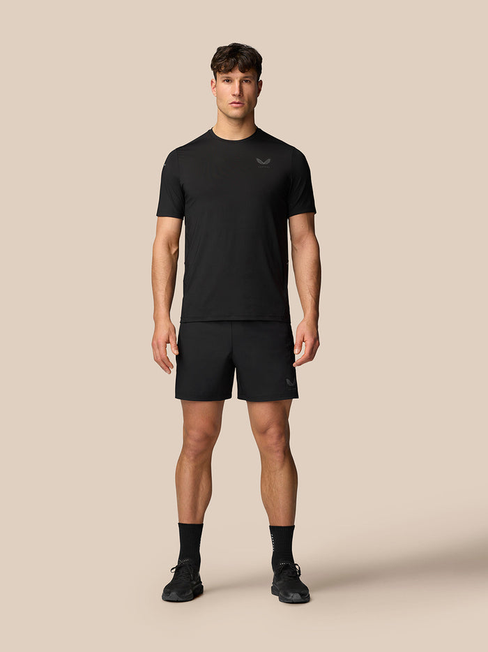 Man wearing black Apex Training T-Shirt with short sleeves and subtle Castore logo on chest