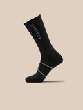 Black crew socks with Castore branding and contrasting gray stripes