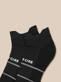 Close up of black ankle socks with Castore branding visible at the cuff