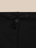 Close-up of a black neck warmer showing a drawstring with eyelets and a cord lock