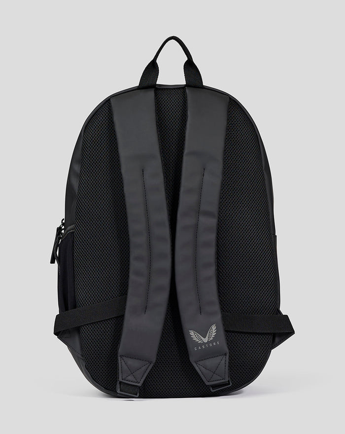 Back view of black unisex core backpack with padded mesh back, adjustable straps, and Castore logo