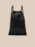Back view of black Castore gym bag with drawstring closure and reinforced base panel