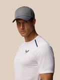 Male model wearing a gray Castore Active Logo Cap with white athletic shirt