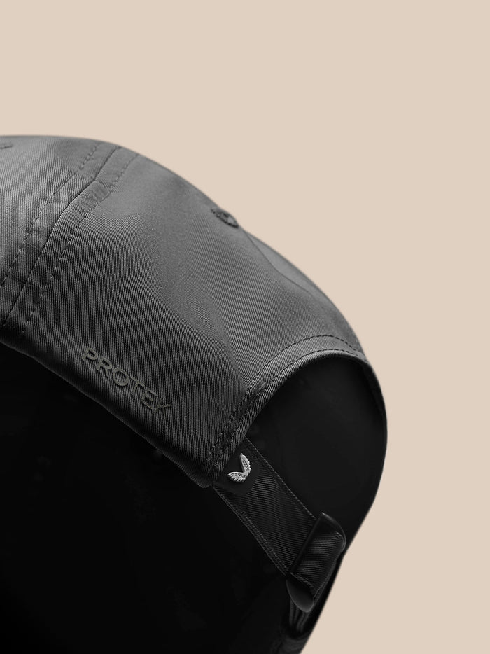 Close up of gray Castore Active Logo Cap showing textured fabric and PROTECT branding along the side