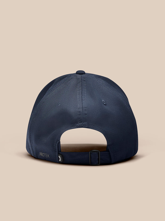 Back view of navy Core Cap with adjustable strap and Protek branding