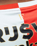 Back view of Feyenoord Pro home shirt 2025-2026 for men with red and white panels and large sponsor text across the upper back