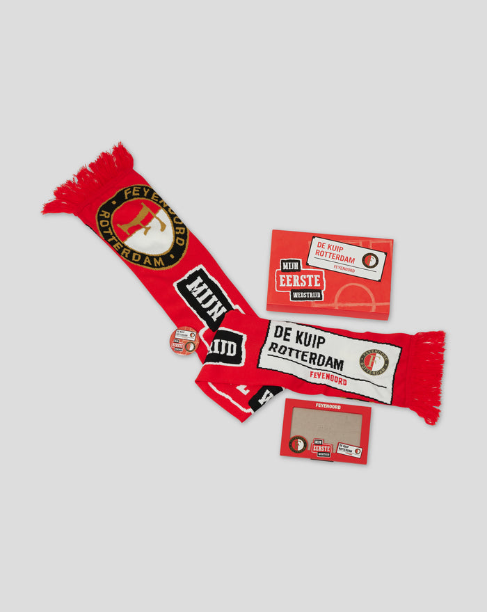 Feyenoord first match set display showing a scarf badges and stickers with a red box