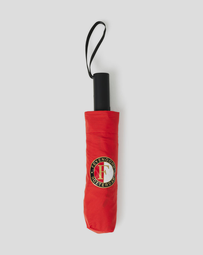 Red Feyenoord folding umbrella with a black handle and loop strap