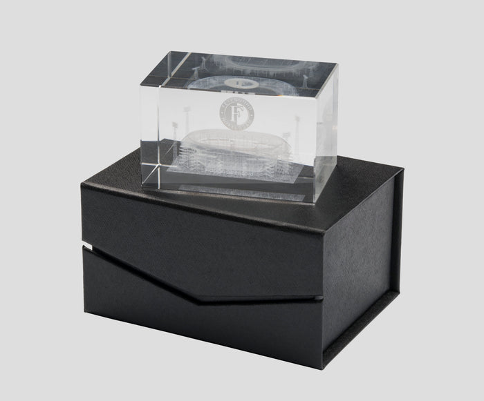 Clear glass block etched with a Feyenoord De Kuip stadium design and emblem on a black display stand