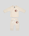 Beige baby wrap top with circular Feyenoord Rotterdam patch