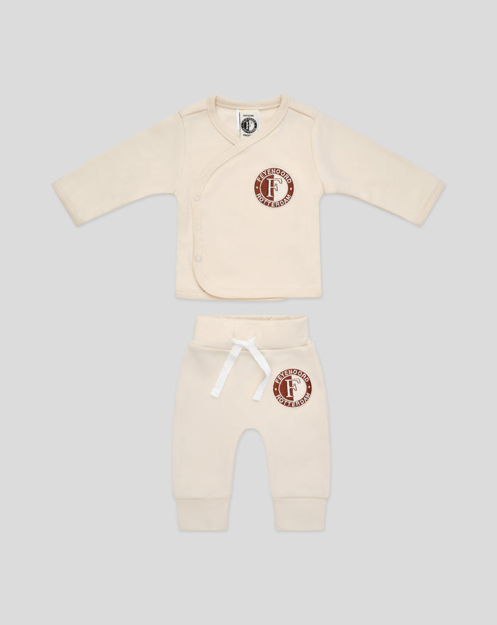 Beige baby wrap top with circular Feyenoord Rotterdam patch