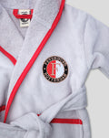 Light grey baby bathrobe with red piping and a Feyenoord Rotterdam emblem on the chest