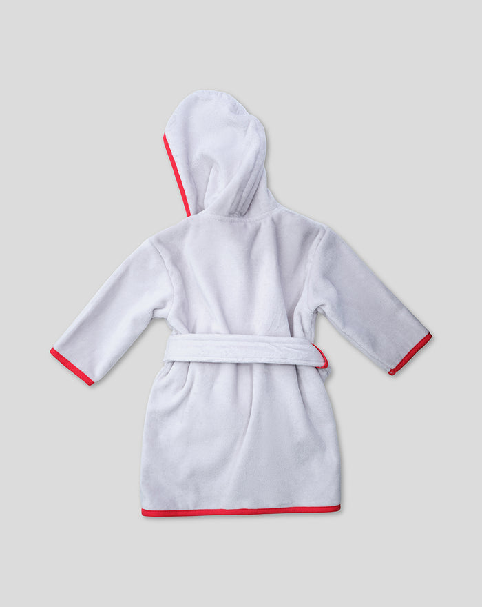 Back view of a white hooded baby bathrobe with red edging and belt