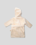 Back view of a beige baby bathrobe with a hood and a tied belt.