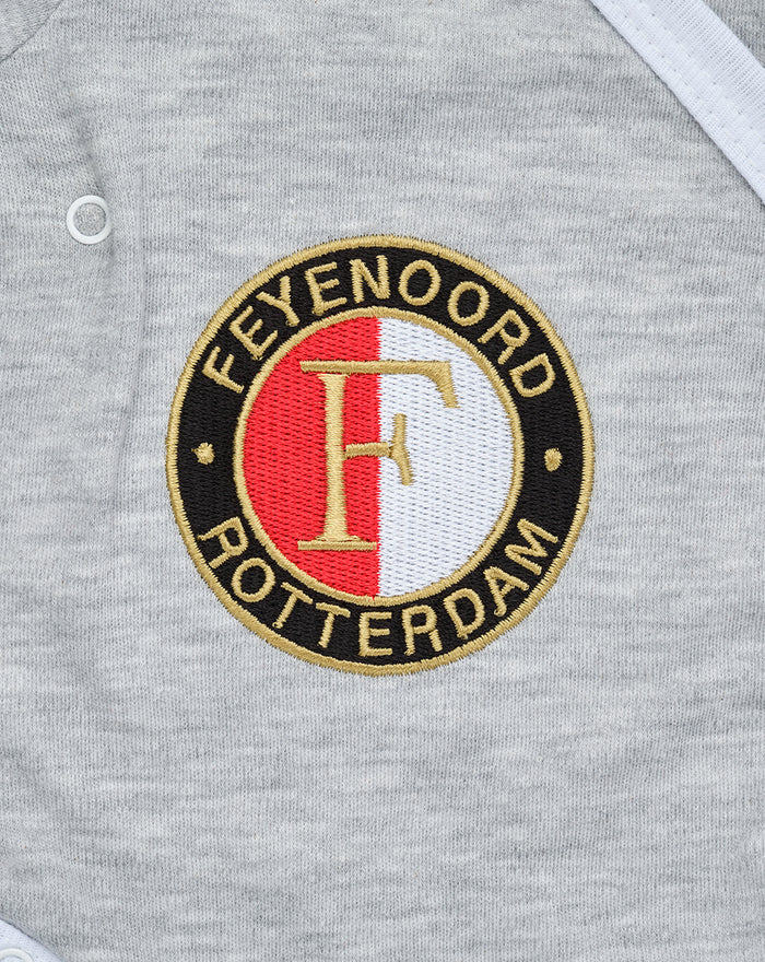 Gray baby romper with circular Feyenoord Rotterdam logo patch.