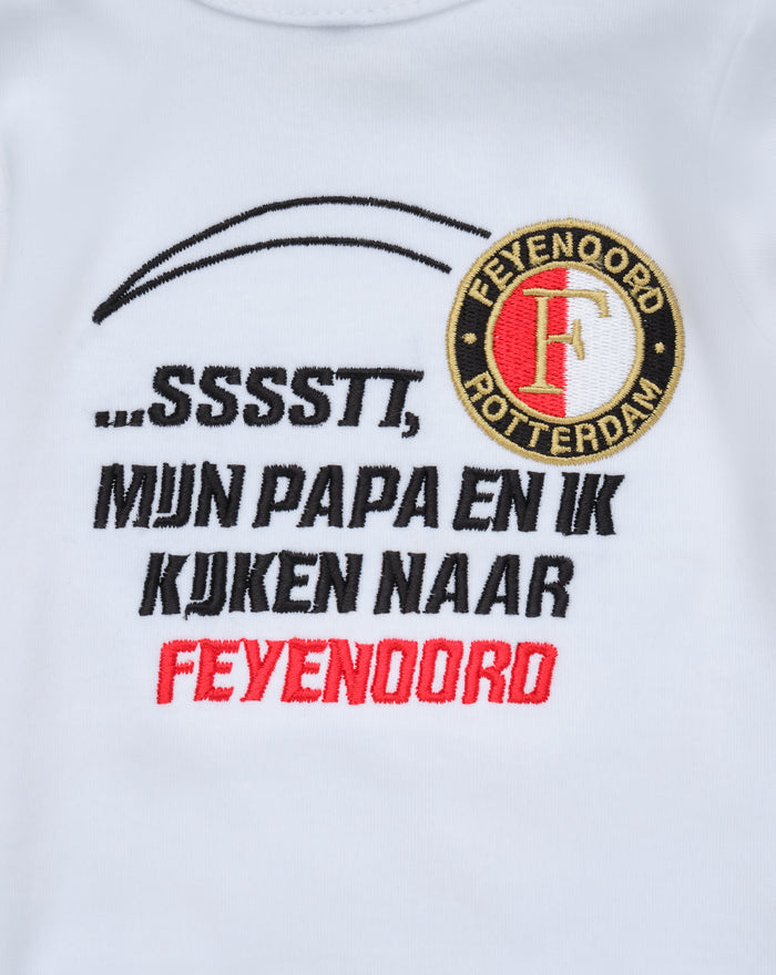 Close up of white baby Feyenoord T shirt with black curved embroidery and round crest patch