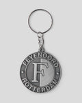 Close up of a silver metal keyring with a round pendant featuring the Feyenoord Rotterdam crest