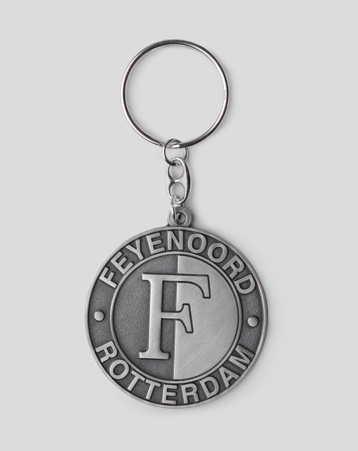 Close up of a silver metal keyring with a round pendant featuring the Feyenoord Rotterdam crest