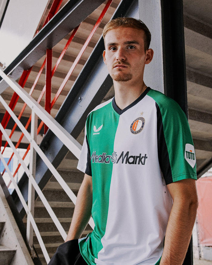 Front view of the Feyenoord Pro Derde Shirt 2024-2025 for men with green and white vertical split crest and sponsor logos