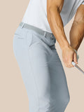 Back view of a man in light gray golf pants with a braided belt, Castore logo on the back pocket.