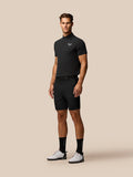 Male model wearing black golf lightweight shorts with ProTek water resistance and Castore logos on the thigh and waistband