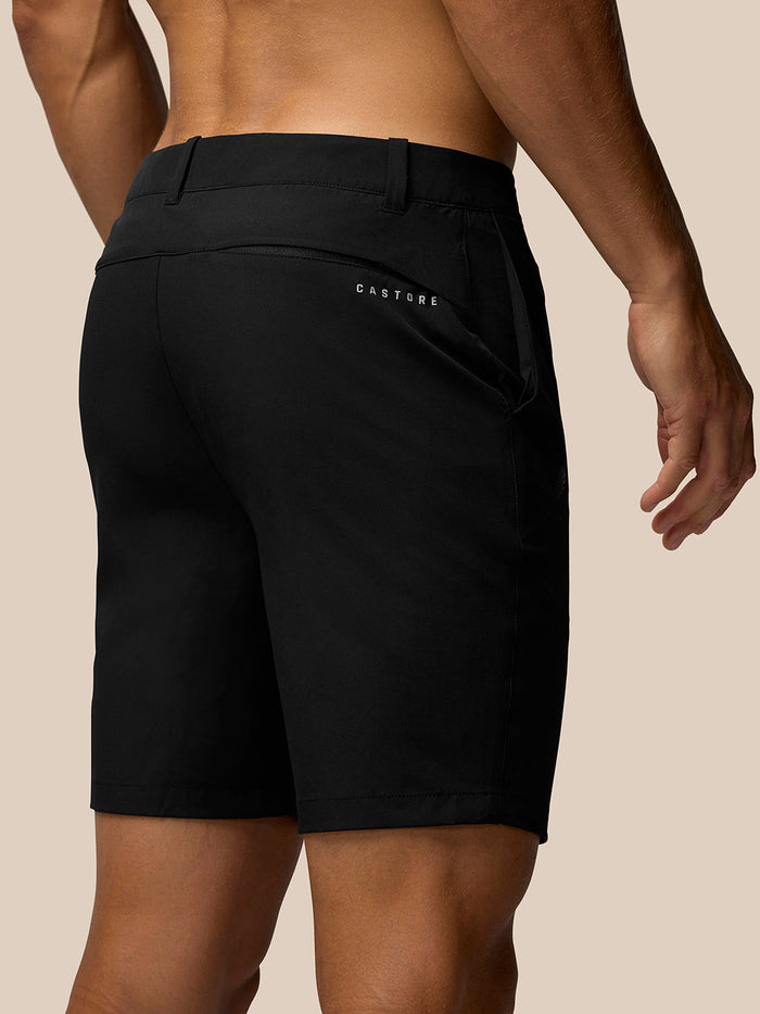 Back view close up of black golf shorts with Castore branding on the rear pocket