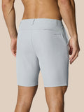 Back view of light gray golf shorts with a right rear pocket and Castore logo