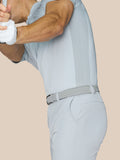 Back view of a man wearing light gray golf shorts with braided belt and ProTek branding