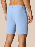 Rear view of light blue golf shorts with back pocket and Castore logo near the pocket