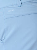 Close up of light blue golf shorts fabric with water droplets, belt loop and ProTek branding on the pocket