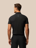Back view of the black Golf Club Essential Polo showing vertical Castore branding along the back