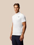 Front view of white golf polo with Castore emblem on the left chest